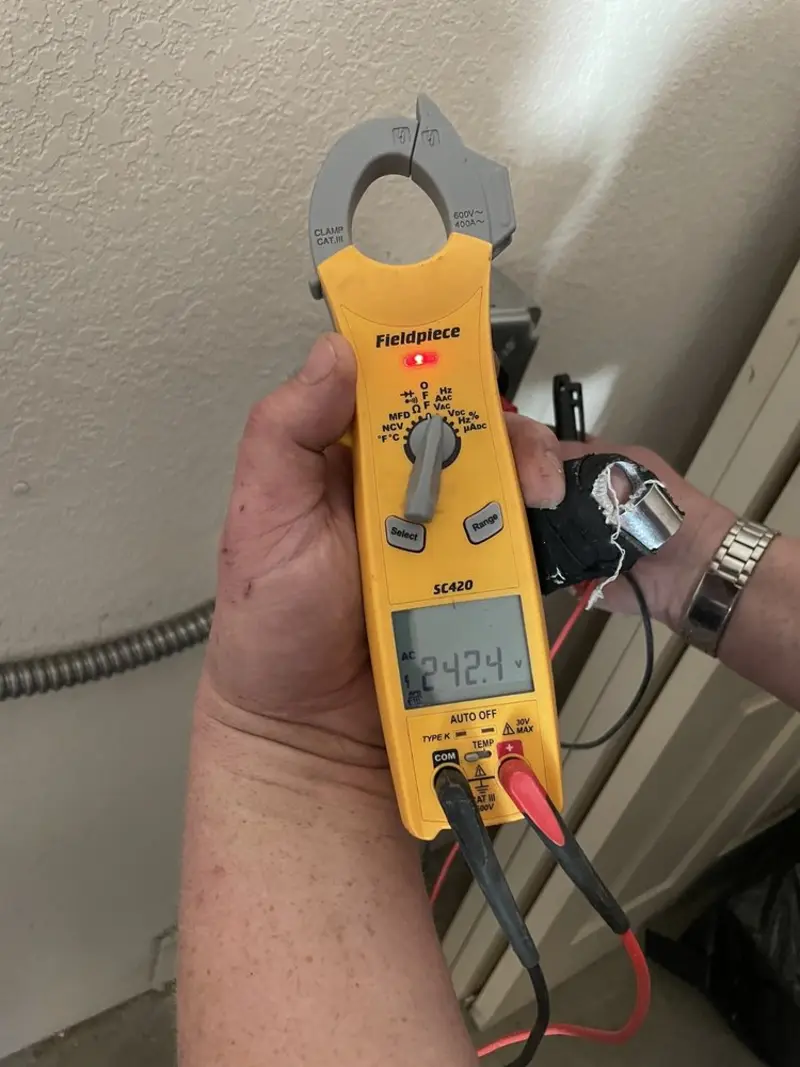 Voltage testing with clamp meter during Outlet Installation in Eagle Lake